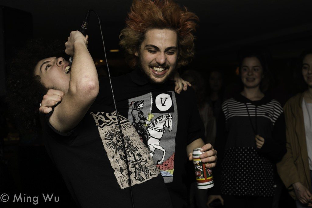 Felix of Toxic Thoughts in the crowd raging with a fan during their set at House of Targ. Photo: Ming Wu