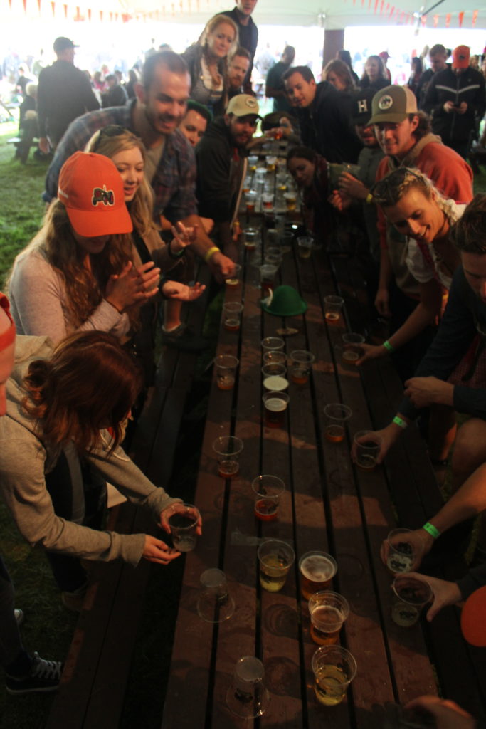 Festival goers honing their flip cup skills at Beau's Oktoberfest 2016. Photo: Eric Scharf