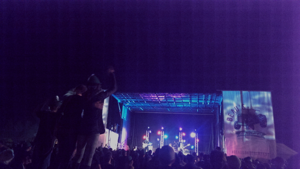 Fans standing on tables to sing along with Joel Plaskett  Emergency at Beau's Oktoberfest in Van Kleek Hill.