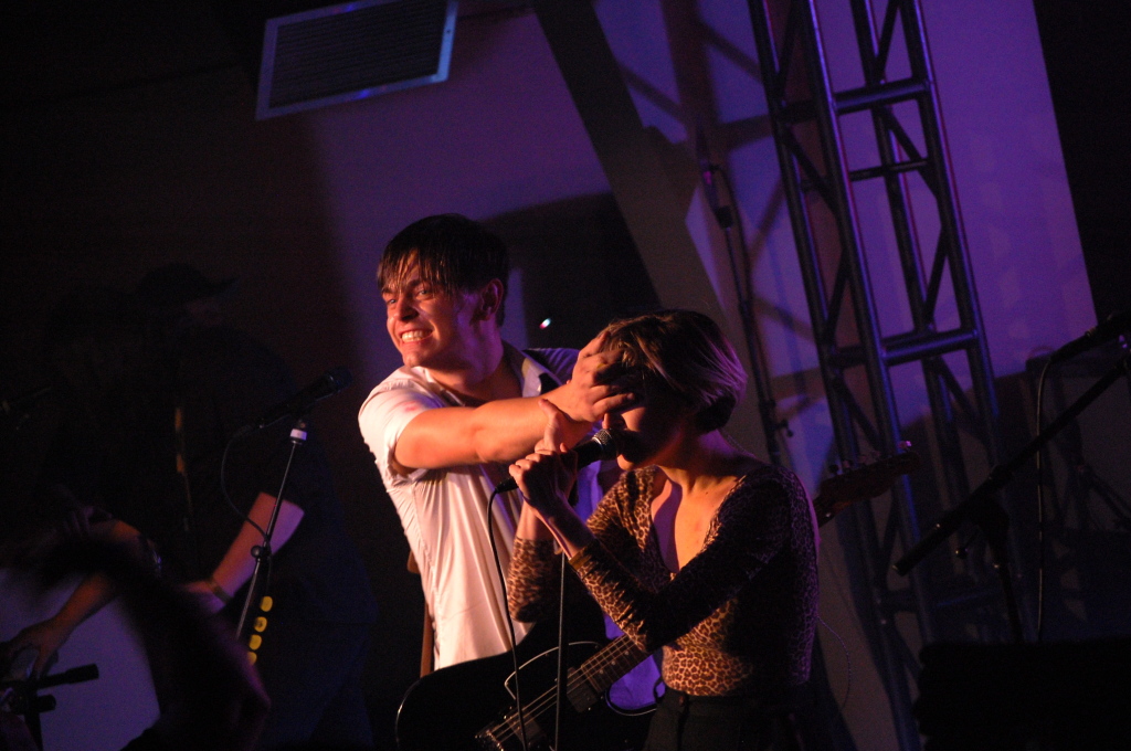 Peter Dreaimanus covering Leah Fay's eyes while she sings. Photo: Eric Scharf