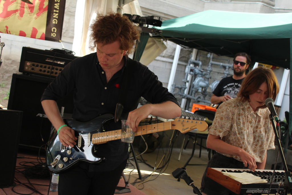 Alex Hamelin of Century Palms using a Beau's glass as a slide at SAW Gallery during Ottawa Explosion Weekend 2016 in Ottawa. Photo: Eric Scharf